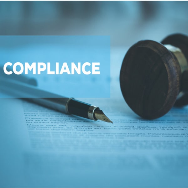 Gavel and quill pen on legal document with word "Compliance" overlaid, symbolizing legal and policy adherence