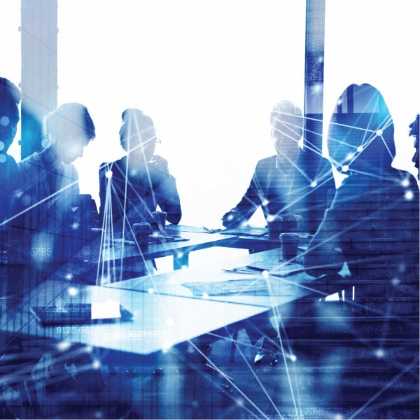 Silhouettes of people in a conference room with digital network overlay, representing connected government teams